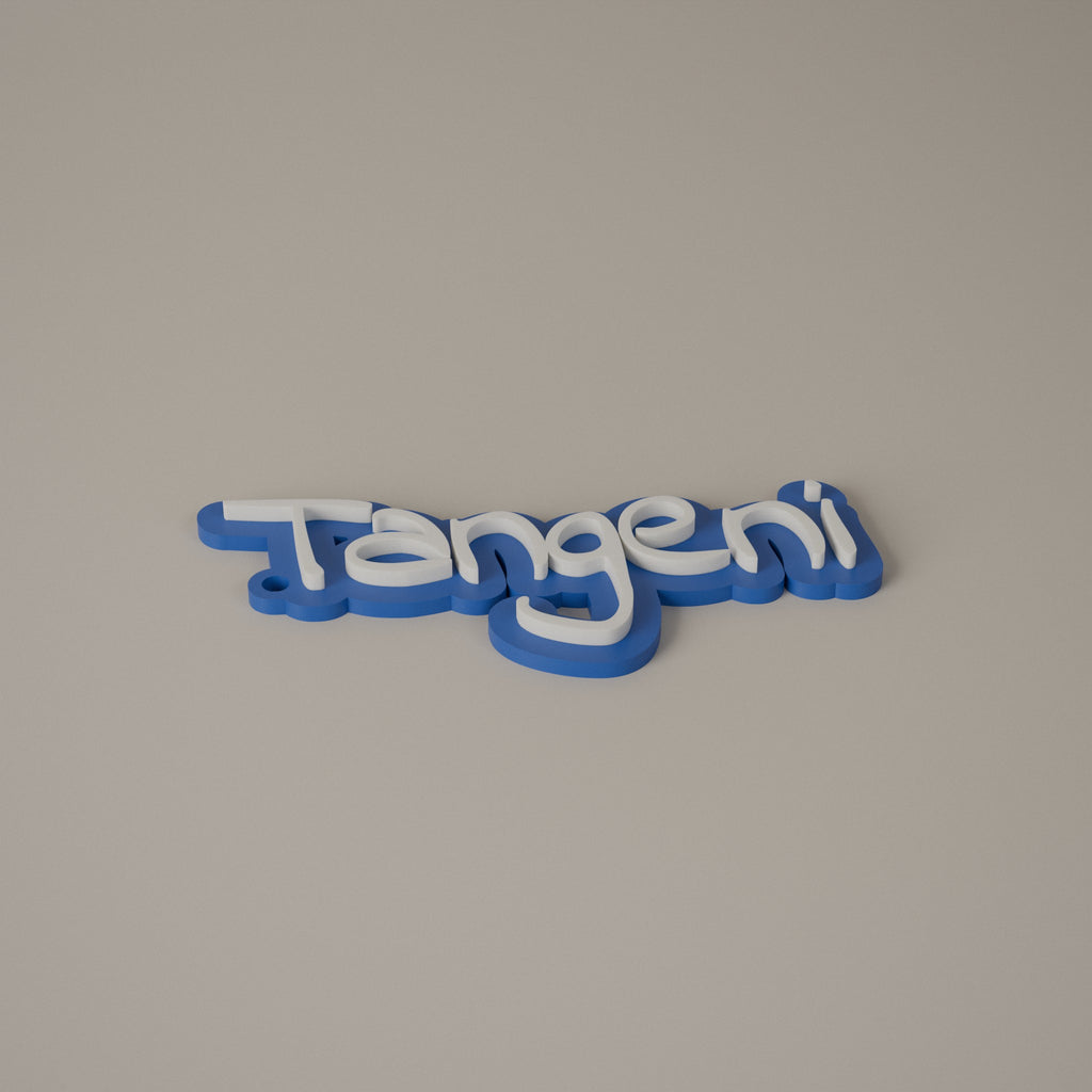 Blue name keyring with white raised letters reading Tangeni