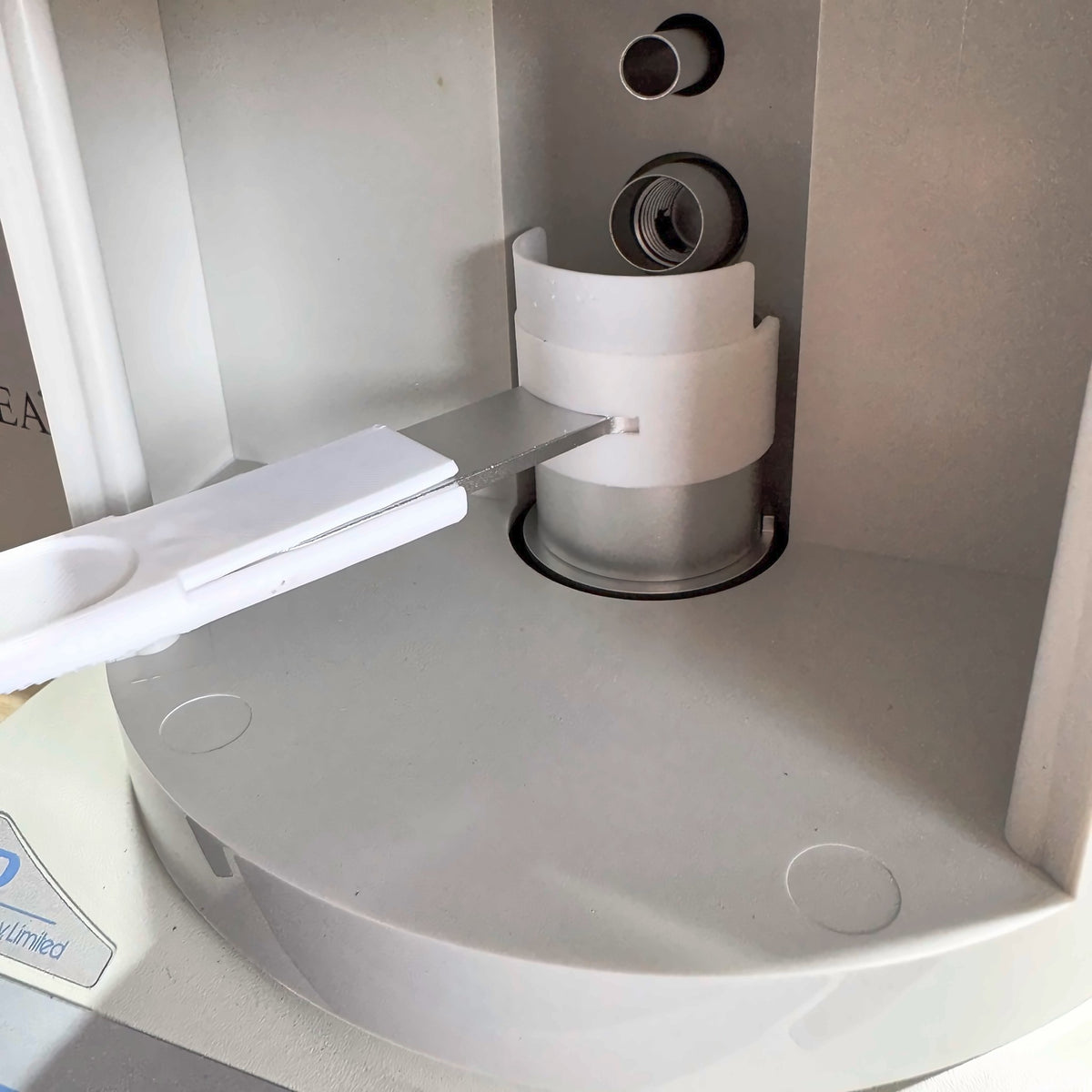 SuperTrickler splash shield inside the machine